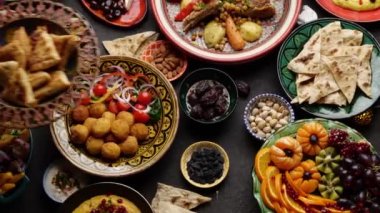 Fasting time at the Ramadan month. Prepared table for iftar. Many traditional foods on the table. High quality 4k footage