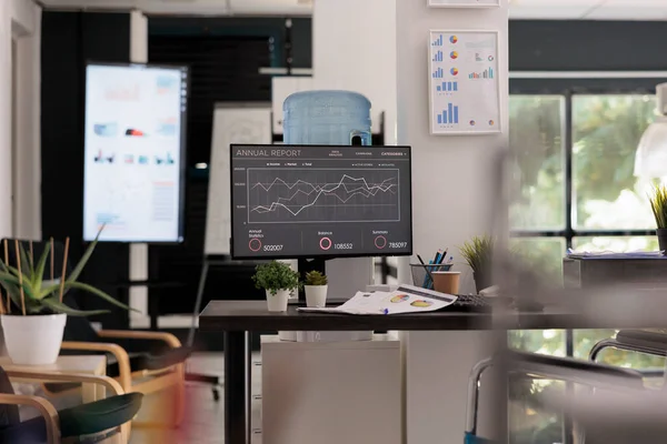 stock image Modern workspace interior of a new start up company in financial district, with no people working in it, disabled friendly office. Screen in the background with sales statistics for next staff meeting