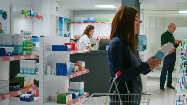 Multiethnic Group Customers Looking Pharmaceutical Products Drugstore Shelves Checking Medicaments — Stock Photo, Image