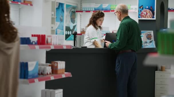 Pharmacist Helping Senior Man Prescription Medicine Giving Treatment Pills Medicaments — Stock Video