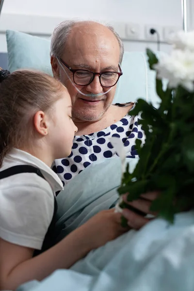 Little Girl Giving Flowers Bouquet Present Hugging Grandfather Admitted Hospital — Stock Photo, Image