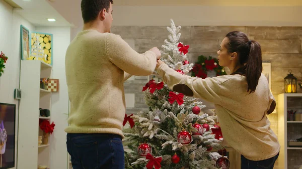 Couple Matching Clothes Decorate Christmas Tree Winter Holidays Decorating Beautiful — Stock Photo, Image