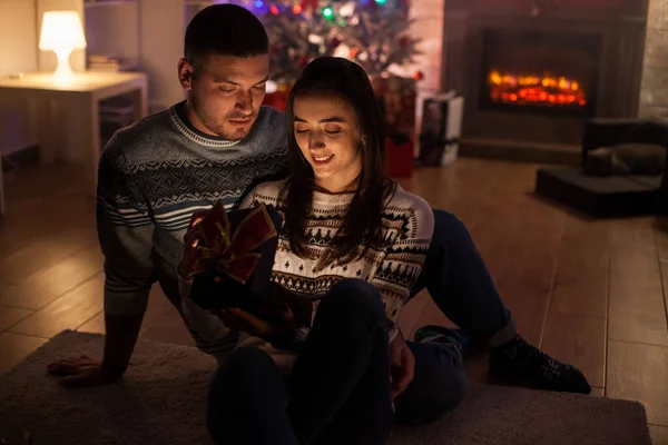 Cheerful Couple Dark Room Excited Magic Christmas Gift — Stock Photo, Image
