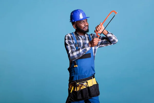 African American Handyman Tool Belt Looking Closely Hand Saw Starting — Stock Photo, Image
