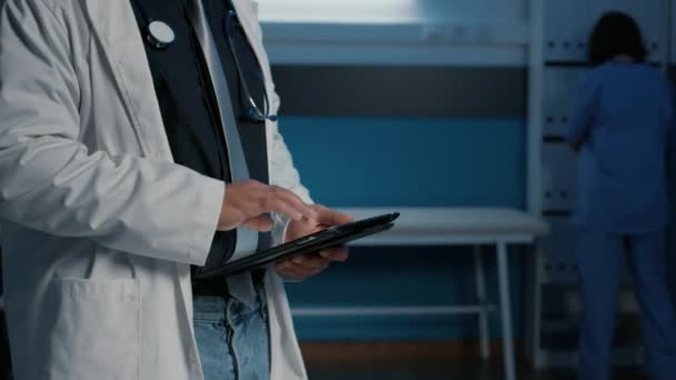 Close Practitioner Medic Holding Tablet Computer Searching Patient Illness Expertise — Stock Video