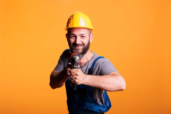 Cheerful Construction Worker Holding Power Drill Gun Posing Studio Looking — Stock Photo, Image
