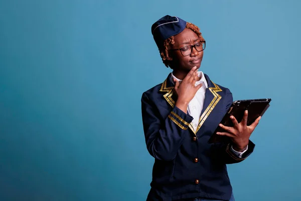 African American Stewardess Wears Airline Uniform Looking Intently Digital Tablet — Stock Photo, Image