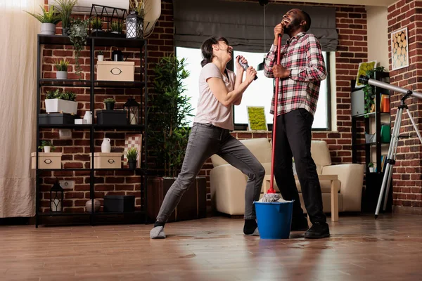Happy Multiracial Couple Singing Emotion Enjoying Housework Together Woman Singing — Stock Photo, Image