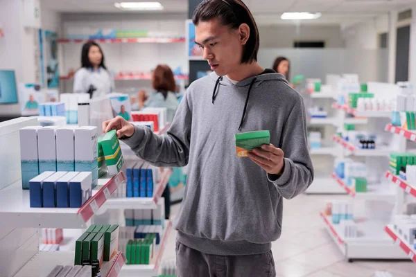 Male Asian Customer Examining Supplements Shelves Client Looking Pills Boxes — Stock Photo, Image