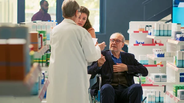 Senior Man Wheelchair Social Caretaker Talking Pharmacist Pharmacy Retail Store — Stock Photo, Image