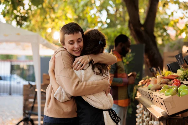 Friendly Farmers Market Vendor Hugging Happy Female Customer While Selling — Stock Photo, Image