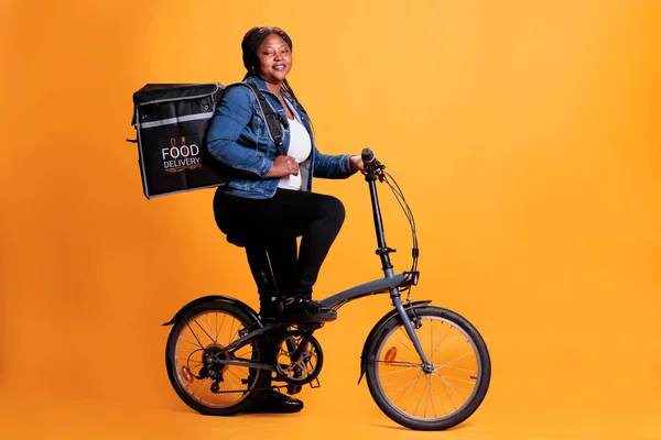 Portrait Fast Food Delivery Worker Riding Bike Lunch Time While — Stock Photo, Image