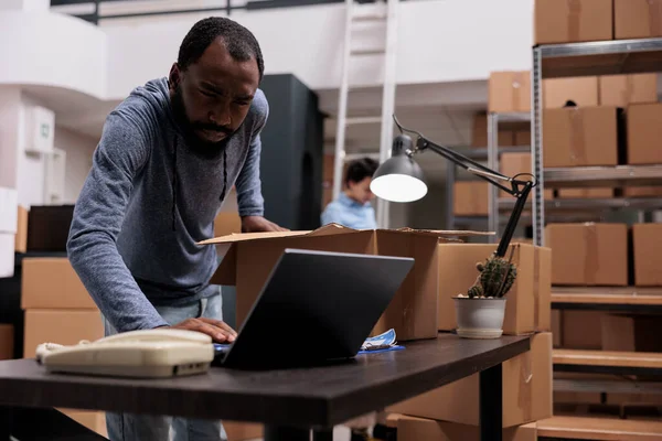 African American Employee Checking Stock Cargo Laptop Computer While Preparing — Stock Photo, Image