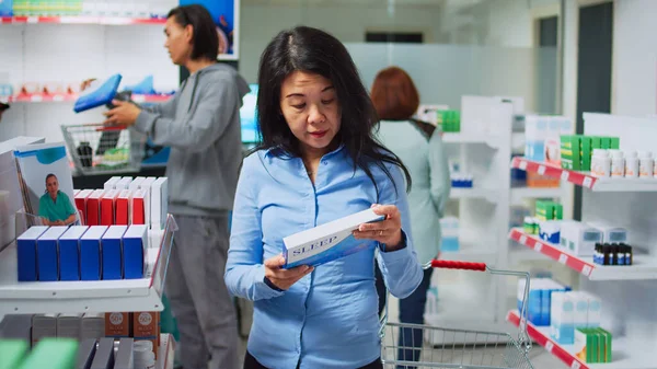 Female Asian Client Reading Prescription Pills Boxes Looking Medicaments Supplements — Stock Photo, Image