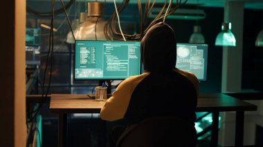 Hackers using network vulnerability to exploit security server, trying to break computer system at night. People working with multiple monitors to hack software, illegal hacktivism. clipart