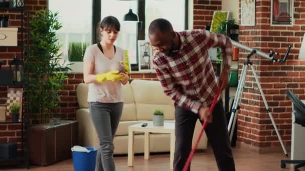 Life Partners Doing Cleaning Chores Together Apartment Mopping Floors Sweeping — Stock Video