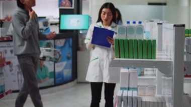 Young man with sore throat asking pharmacist about medicine, dealing with coughing and neck pain. Pharmacy consultant helping male client with disease treatment and painkillers.