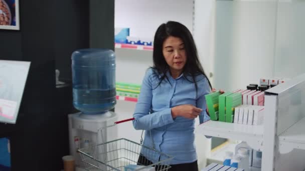Female Customer Choosing Vitamins Drugs Pharmacy Shelves Analyzing Packages Pharmaceutical — Video Stock