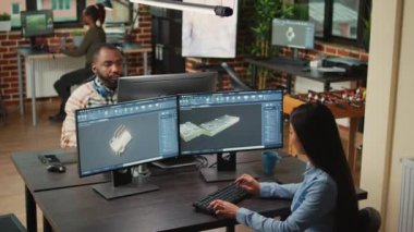 Engineering worker developing industrial component prototype on professional cad software, improving machine clamp. Asian graphic technician sketching 3D product or component, creative industry.