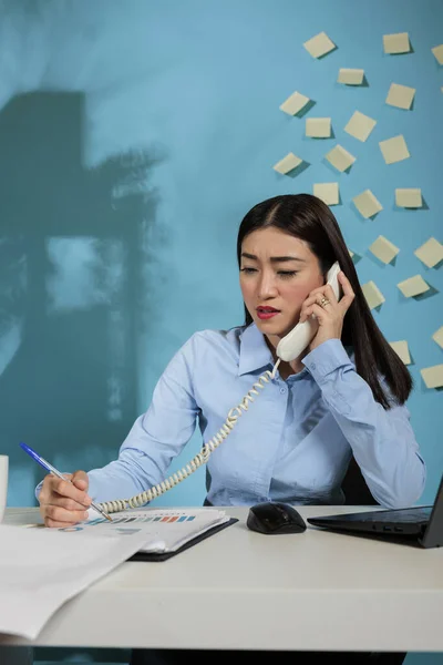 Busy Asian Woman Startup Office Talking Landline Phone Looking Papers — Zdjęcie stockowe