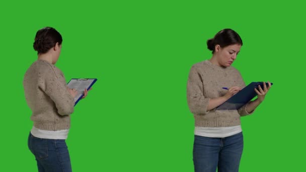 Close Relaxed Person Checking Clipboard Files Camera Standing Green Screen — 비디오