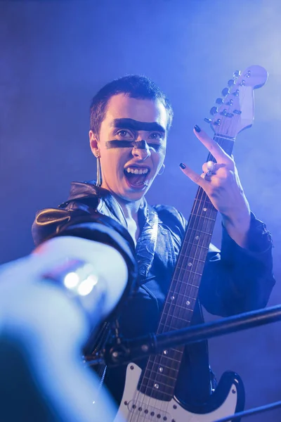 Crazy Artist Playing Bass Guitar Studio Smoke Showing Rock Sign — Stockfoto