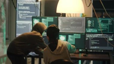 Team of hackers working on breaking computer system, using phishing concept to steal valuable information. People committing cyberattack and cybercrime, making online privacy threats.