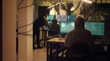 Law enforcement stopping hackers to do illegal activity, police operation with lights maintaining online web safety. Team of cyber criminals running away, not getting caught at night.