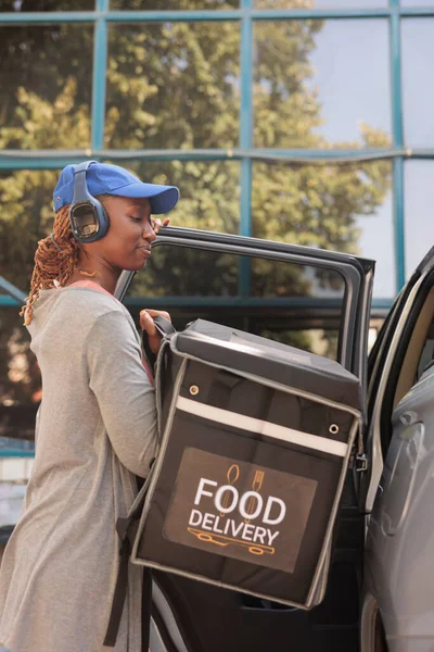 Young Courier Headphones Delivering Restaurant Food Order Car Delivery Service — Stockfoto