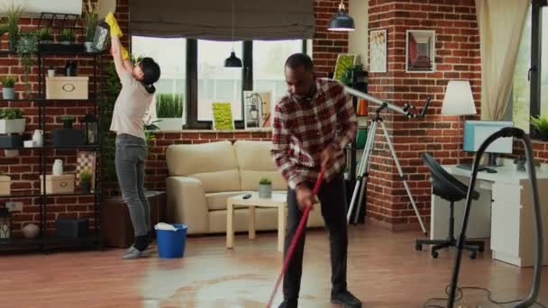 Diverse People Vacuuming Floors Cleaning Furniture Shelves Sweeping Mess Dirt — Stockvideo