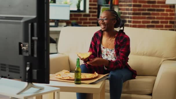 Young Adult Eating Slice Pizza Living Room Enjoying Action Movie — Video