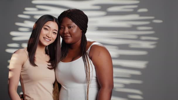 Happy Diverse Ladies Hugging Posing Studio Promoting Wellness Bodycare Self — Vídeo de Stock