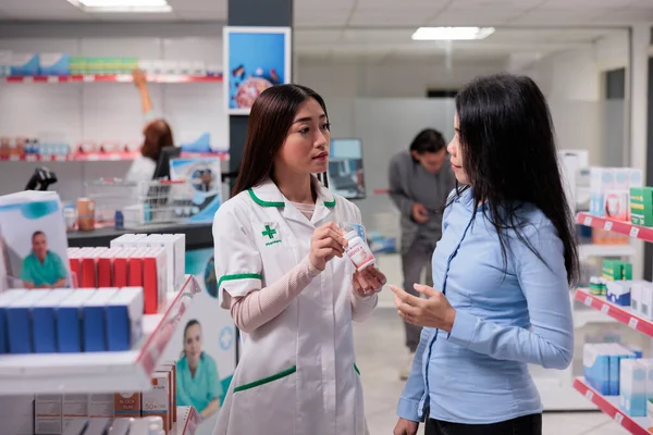 Medical Worker Giving Assistance Asian Client Talking Medicine Boxes Pharmaceutical —  Fotos de Stock