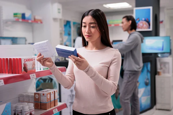 Asian Woman Analyzing Packages Pills Pharmacy Looking Medicaments Boxes Buy — Stock Photo, Image