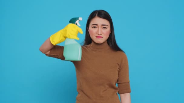 Upset Angry Maid Putting Detergent Spray Front Temple While Pretending — 图库视频影像