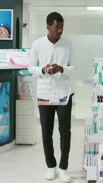 Vertical Video Young Customer Checking Packs Medicine Shelves Looking Buy — Stock Video
