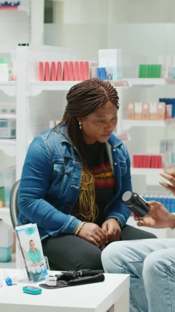 Vertical Video African American Doctor Giving Bottle Pills Woman Explaining — Video