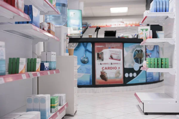 Empty pharmacy equipped with medicaments containers and supplements packages, retail shop shelves with pharmaceutical products. Drugstore space filled with medical supplement and drugs bottles.