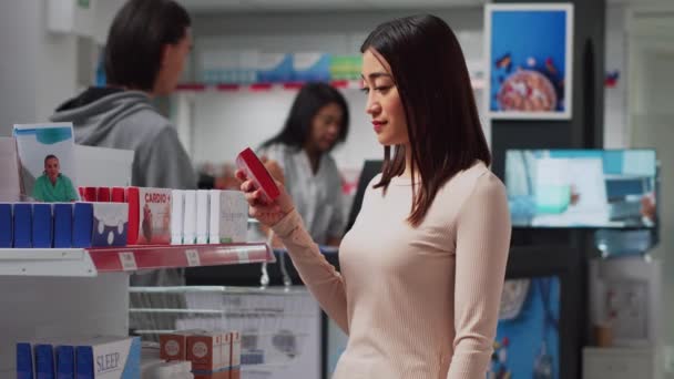 Woman Customer Taking Vitamins Box Drugstore Shelves Searching Medicaments Pills — Stock video