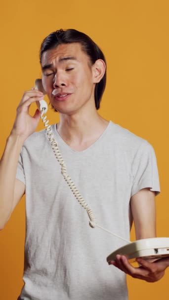 Vertical Video Young Person Answering Landline Phone Call Camera Positive — 图库视频影像