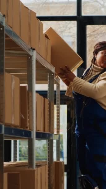 Vertical Video Storehouse Workers Taking Boxes Racks Working Ladder Laptop — Vídeos de Stock