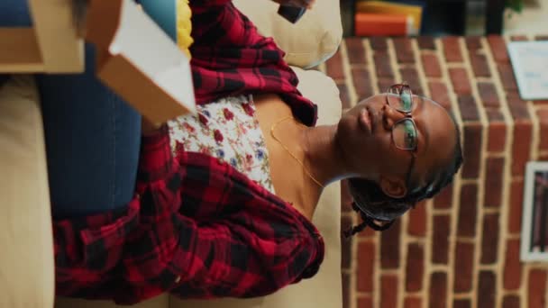 Vertical Video African American Girl Opening Television Watch Movie Eating — стокове відео