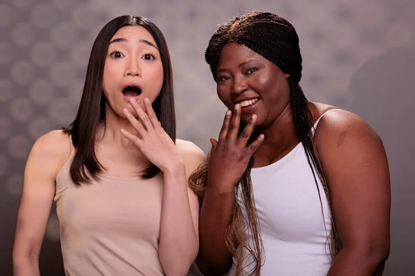 Two Diverse Surprised Women Laughing Hand Mouth Hearing Funny Joke — Stock Photo, Image