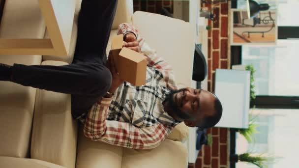 Vertical Video Modern Man Eating Hamburger Fries Couch Having Dinner — Stockvideo