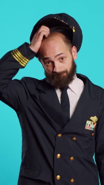 Vertical Video Airline Captain Raising Shoulders Being Unsure Shrugging Knowing — Stockvideo