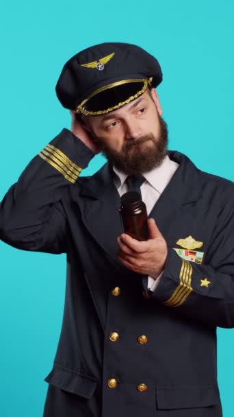 Vertical Video Aircrew Captain Looking Bottles Vitamins Feeling Uncertain Supplements — стокове відео