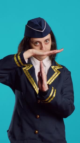 Vertical Video Professional Stewardess Showing Shape Sign Studio Asking Pause — Stockvideo