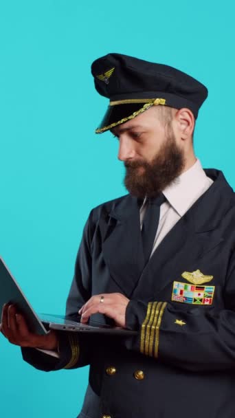 Vertical Video Modern Aircrew Captain Using Laptop Camera Browsing Online — 비디오