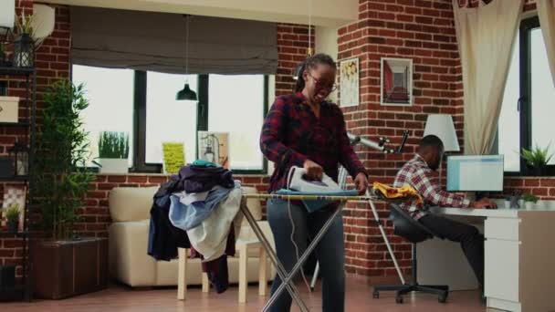 Female Adult Enjoying Doing Laundry Work Home Having Fun Listening — Stock video