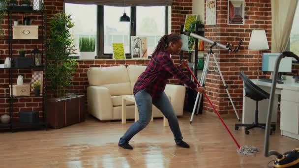Cheerful Girlfriend Dancing Apartment Using Mop Sweep Floors Listening Music — Vídeos de Stock